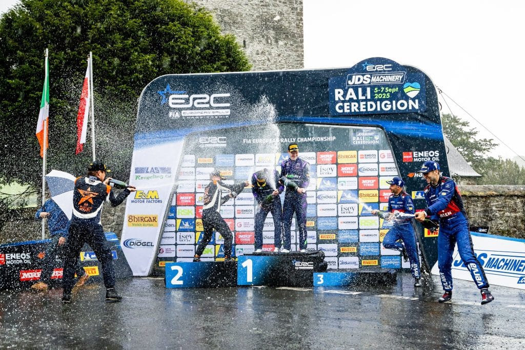 jon and shayne champagne podium